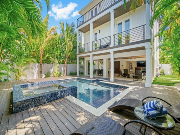 Luxurious 7 Bedroom Home Featuring a Tropical Outdoor Oasis