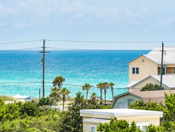 Charming Coastal Home with Five Bedrooms & Partial Ocean Views
