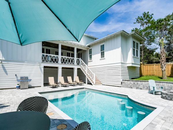 Charming Coastal Home with Five Bedrooms & Partial Ocean Views