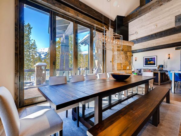 Dining area with window wall that fully opens to the top deck