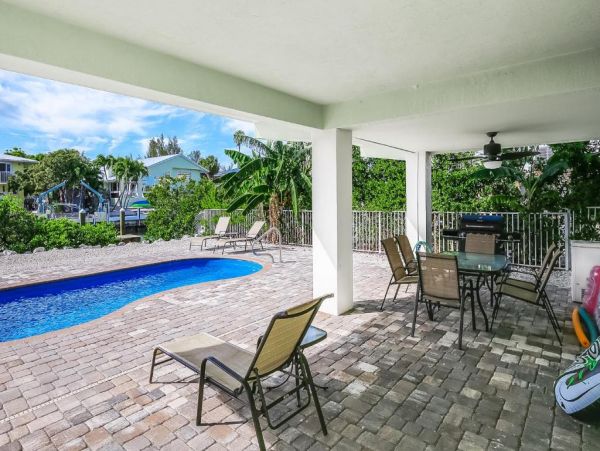 Waterfront 4 Bedroom Home with Pool Dock & View of Canal