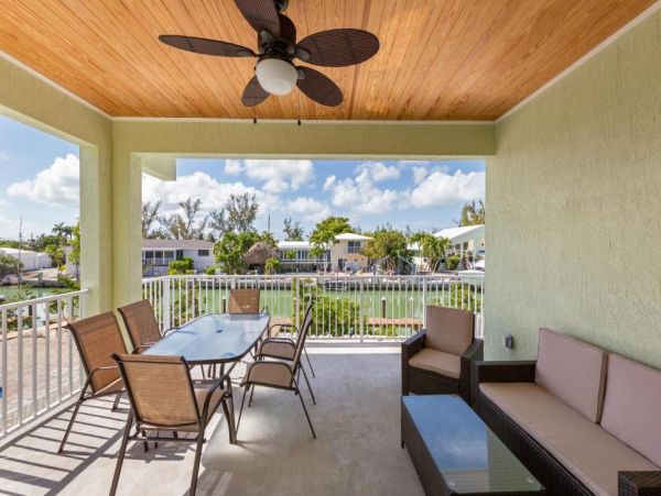 Waterfront 4 Bedroom Home with Pool Dock & View of Canal