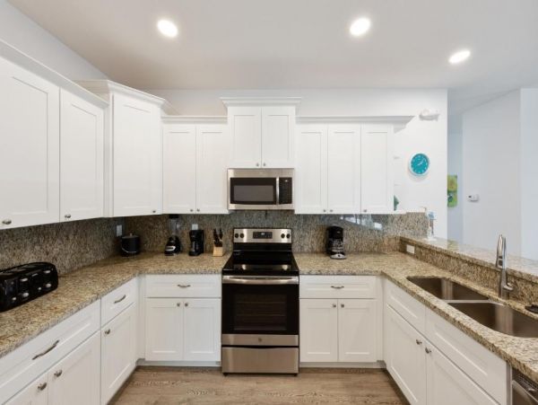 Waterfront 4 Bedroom Home with Pool Dock & View of Canal