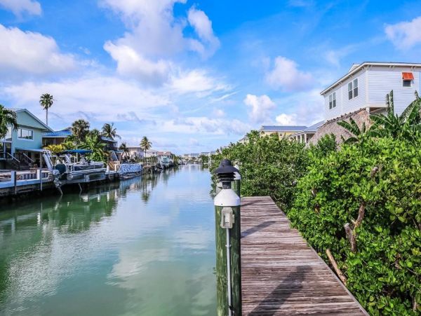 Waterfront 4 Bedroom Home with Pool Dock & View of Canal
