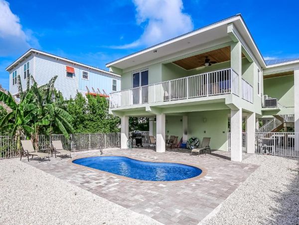 Waterfront 4 Bedroom Home with Pool Dock & View of Canal