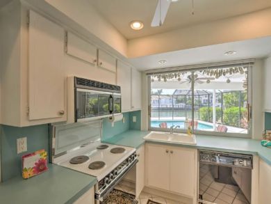 Canal Front 4 Bedroom Home with Private Caged Pool in Naples