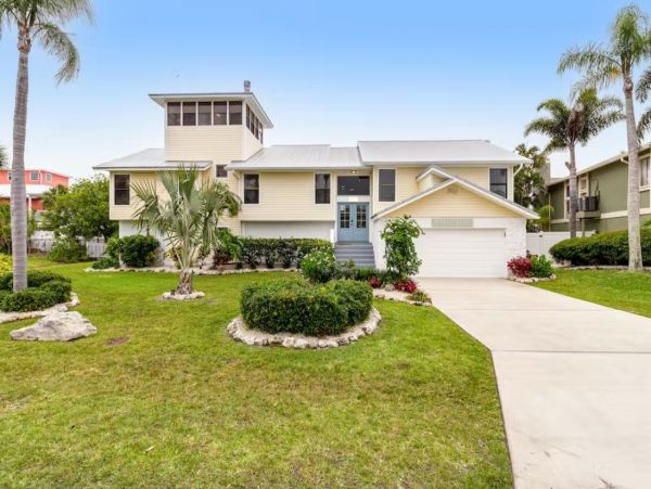 Stunning 4 Bedroom Home on the Canal with Pool and Dock