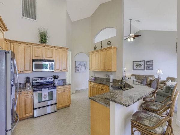Marco Island Walk to Beach & Canal View Four Bedroom Home