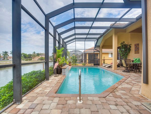 Marco Island 6 Bedroom Canal Front Home with Caged Pool