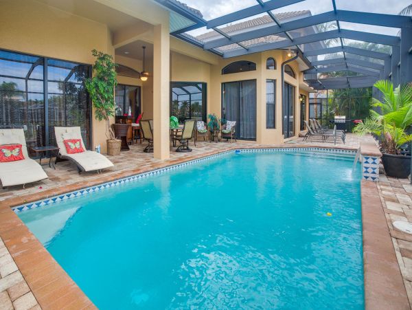 Marco Island 6 Bedroom Canal Front Home with Caged Pool