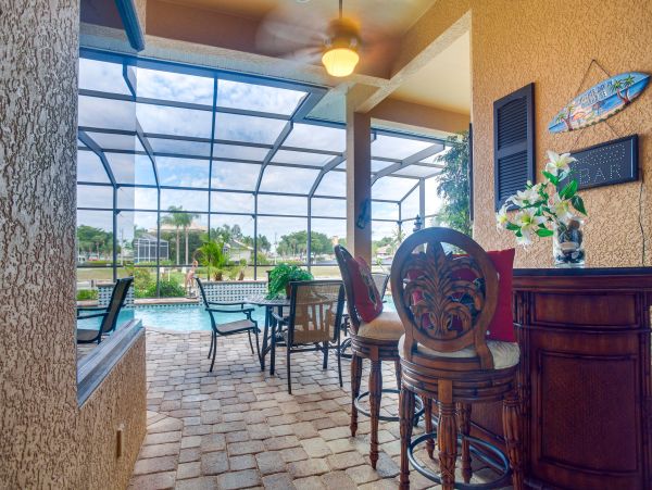 Marco Island 6 Bedroom Canal Front Home with Caged Pool