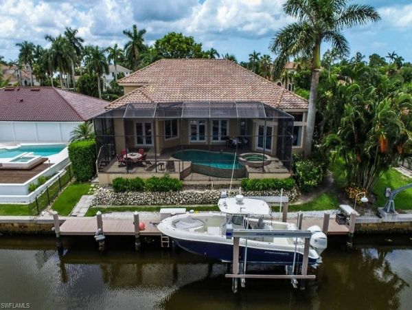 Impeccable Naples Waterfront Home with Caged Pool & Spa