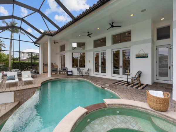 Impeccable Naples Waterfront Home with Caged Pool & Spa