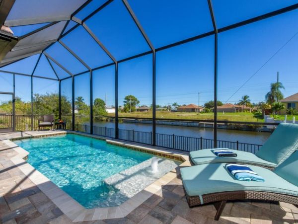 3 Bedroom Canal Front Home in Cape Coral with Caged Pool