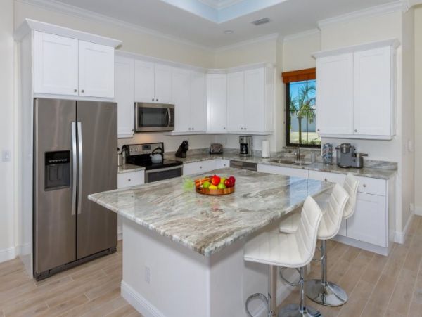 3 Bedroom Canal Front Home in Cape Coral with Caged Pool