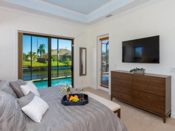 3 Bedroom Canal Front Home in Cape Coral with Caged Pool