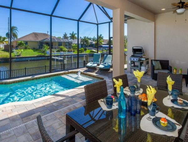 3 Bedroom Canal Front Home in Cape Coral with Caged Pool