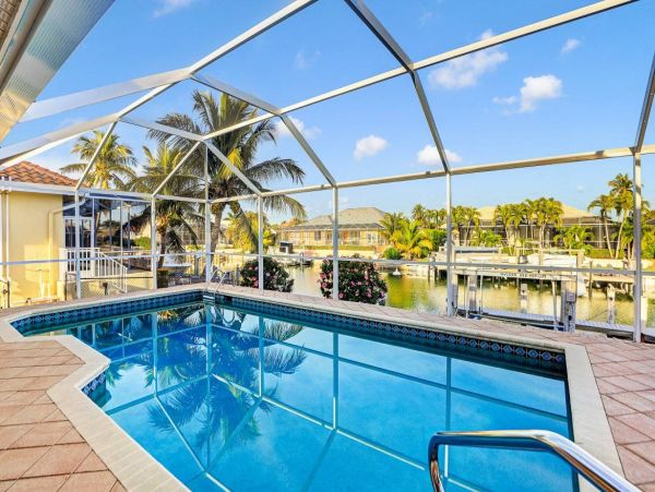 Beautiful Canal Views 3 Bedroom Home with Caged Pool