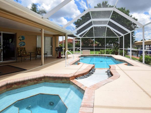 Beautiful Canalfront Three Bedroom Home with Caged Pool
