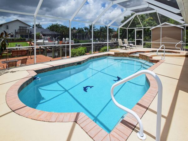 Beautiful Canalfront Three Bedroom Home with Caged Pool