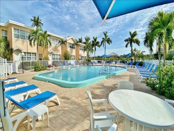 Upscale 1st floor condo with private entrance , patio, pool, washer, dryer & A/C