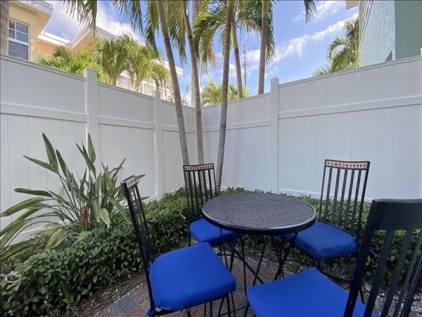 Upscale 1st floor condo with private entrance , patio, pool, washer, dryer & A/C