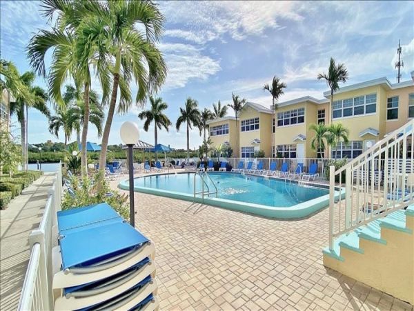 Upscale 1st floor condo with private entrance , patio, pool, washer, dryer & A/C