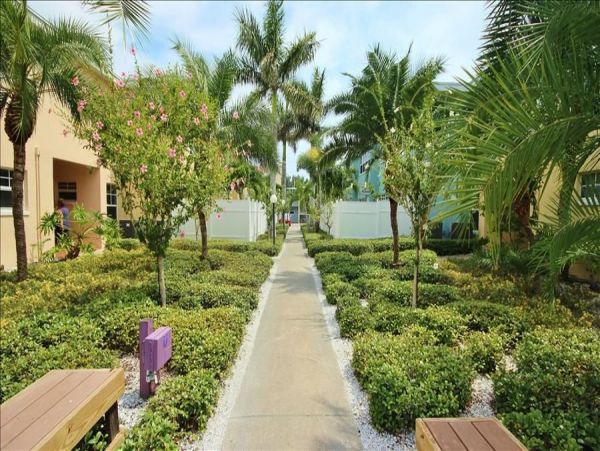 Upscale 1st floor condo with private entrance , patio, pool, washer, dryer & A/C