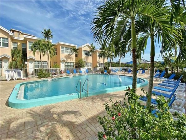 Upscale 1st floor condo with private entrance , patio, pool, washer, dryer & A/C