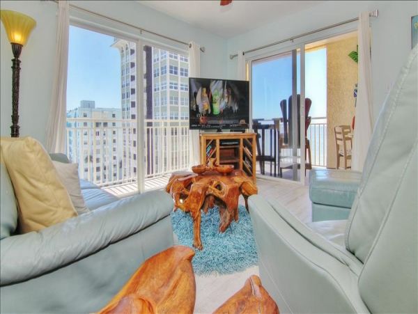 Beachfront Condo with private balcony , views, heated pool , hot tub & AC