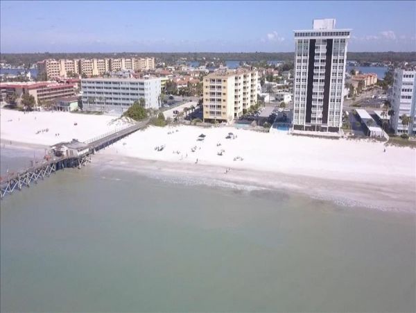 Beachfront Condo with private balcony , views, heated pool , hot tub & AC