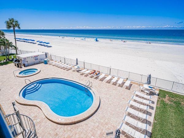Gulf Front Vacation Rental - Family Friendly Condo with Pool & Balcony