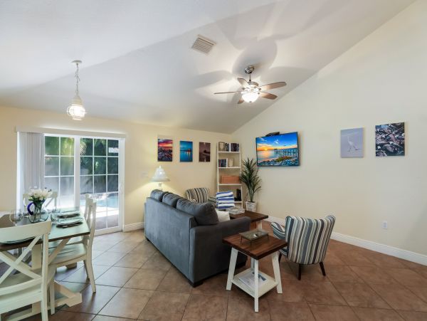 Remodeled Duplex with private pool 1/2 block to beach with a Golf Cart