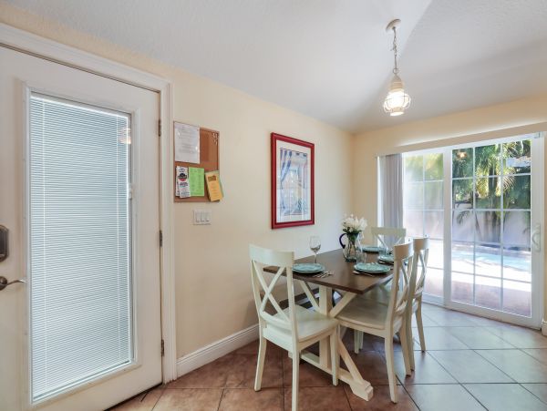 Remodeled Duplex with private pool 1/2 block to beach with a Golf Cart
