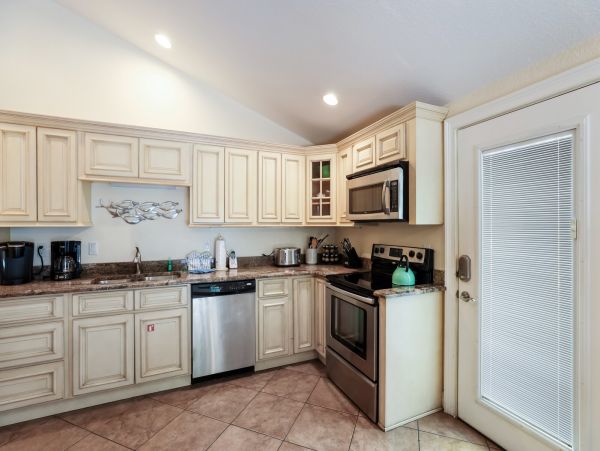 Remodeled Duplex with private pool 1/2 block to beach with a Golf Cart