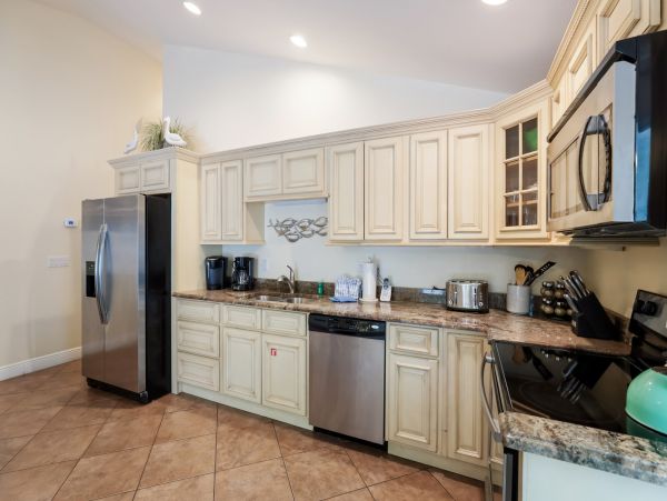 Remodeled Duplex with private pool 1/2 block to beach with a Golf Cart