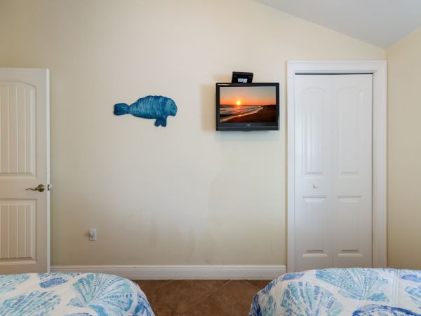 Remodeled Duplex with private pool 1/2 block to beach with a Golf Cart
