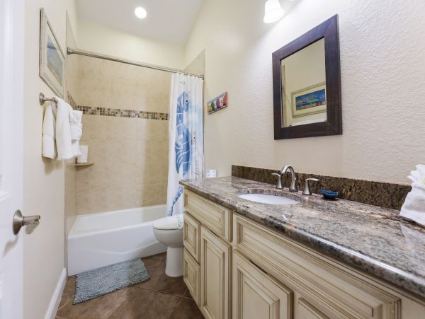 Remodeled Duplex with private pool 1/2 block to beach with a Golf Cart