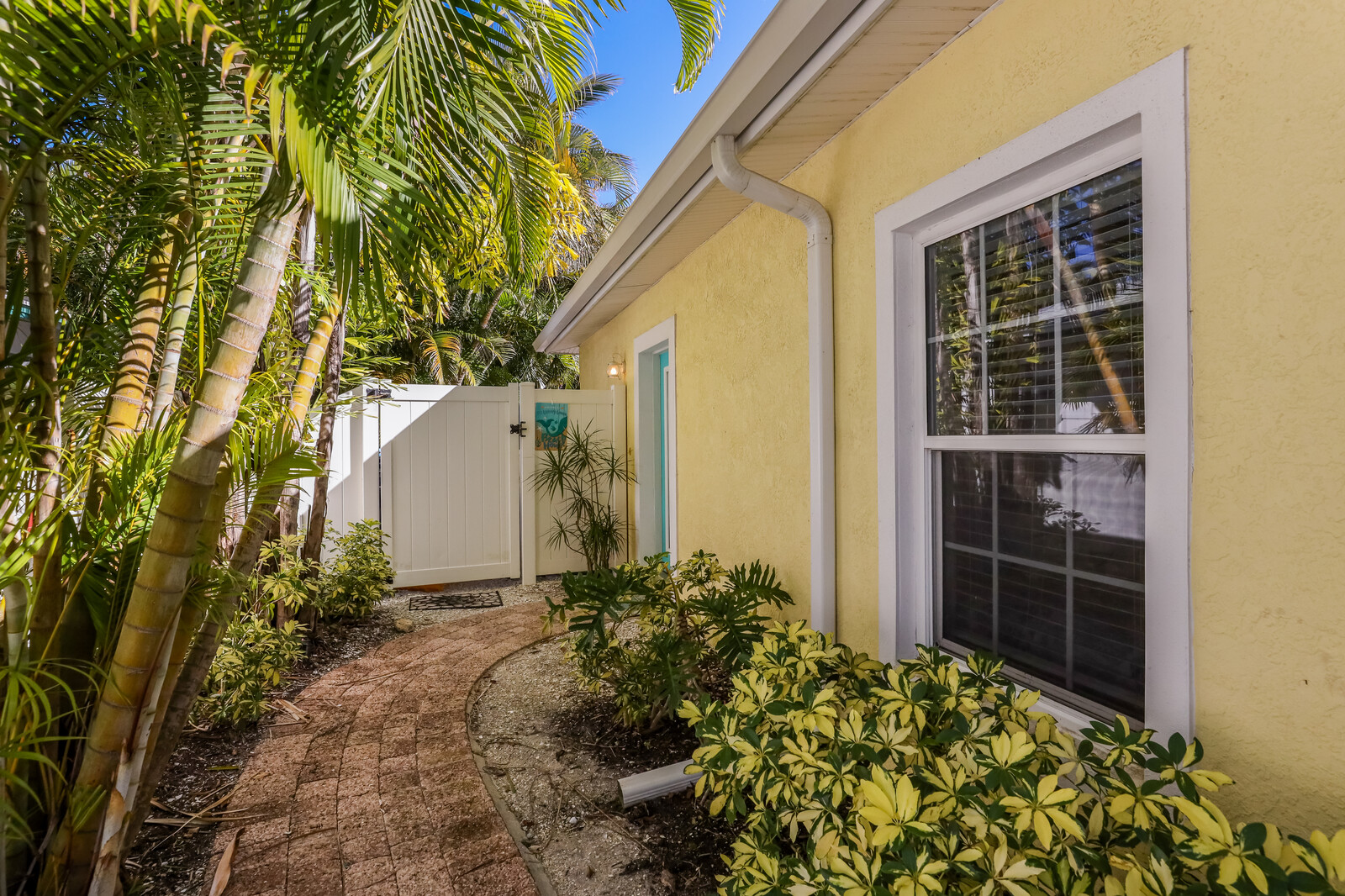Remodeled Duplex with private pool 1/2 block to beach with a Golf Cart
