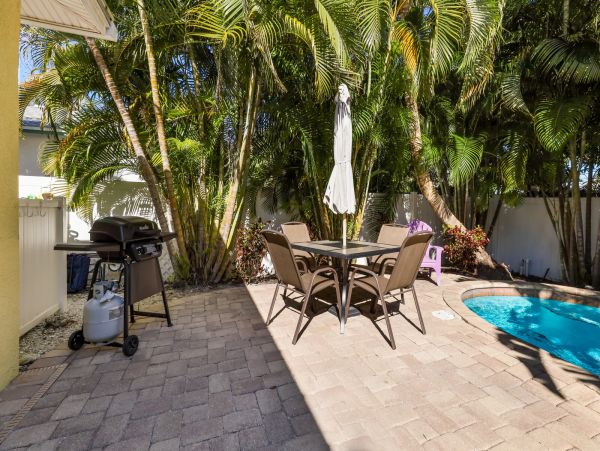 Remodeled Duplex with private pool 1/2 block to beach with a Golf Cart