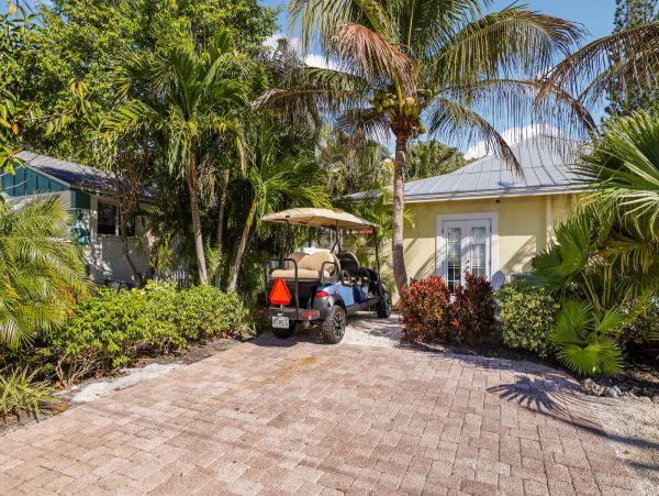 Remodeled Duplex with private pool 1/2 block to beach with a Golf Cart