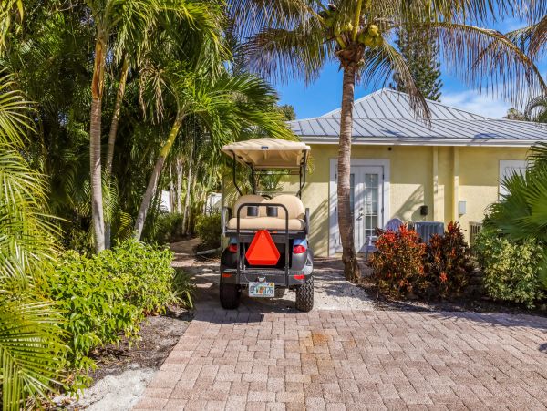 Remodeled Duplex with private pool 1/2 block to beach with a Golf Cart