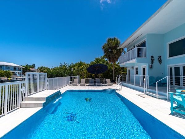 Key Colony Beach Pool Home with Boat Dock Steps To Beach