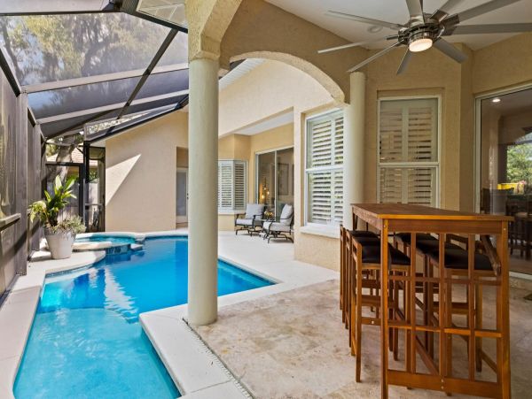 Four Bedroom Fun Home with Pool and Tiki Bar with TV