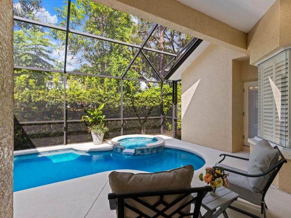 Four Bedroom Fun Home with Pool and Tiki Bar with TV