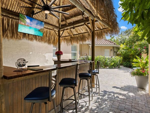 Four Bedroom Fun Home with Pool and Tiki Bar with TV