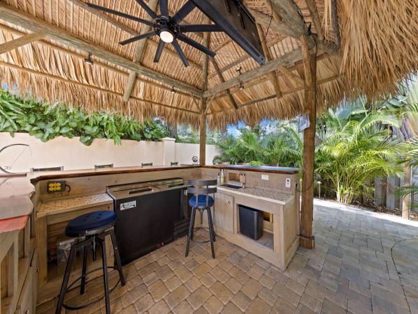 Four Bedroom Fun Home with Pool and Tiki Bar with TV