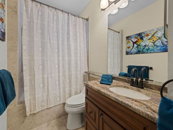 Four Bedroom Fun Home with Pool and Tiki Bar with TV