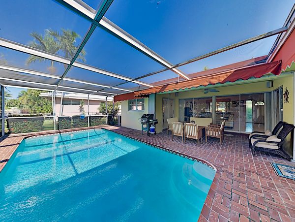 Canal-Front Vacation Home with Pool and Boat Dock