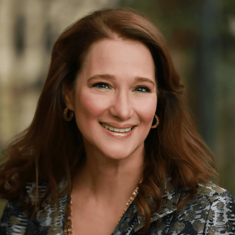 Headshot of Amy Werner Chronis against a blurred background.